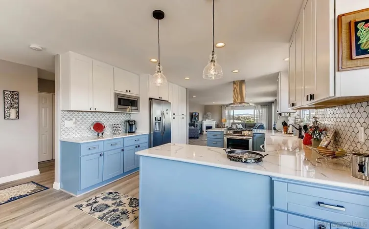 Blue and white kitchen remodel by Merribuild