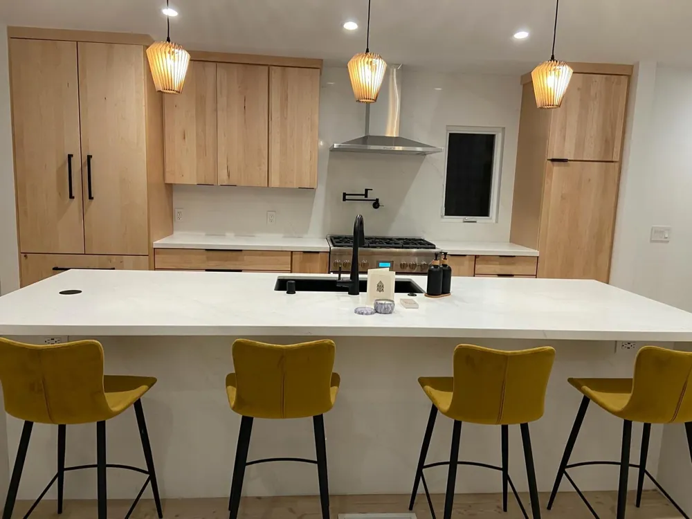 Oak kitchen with island seating by RCS Pro Build